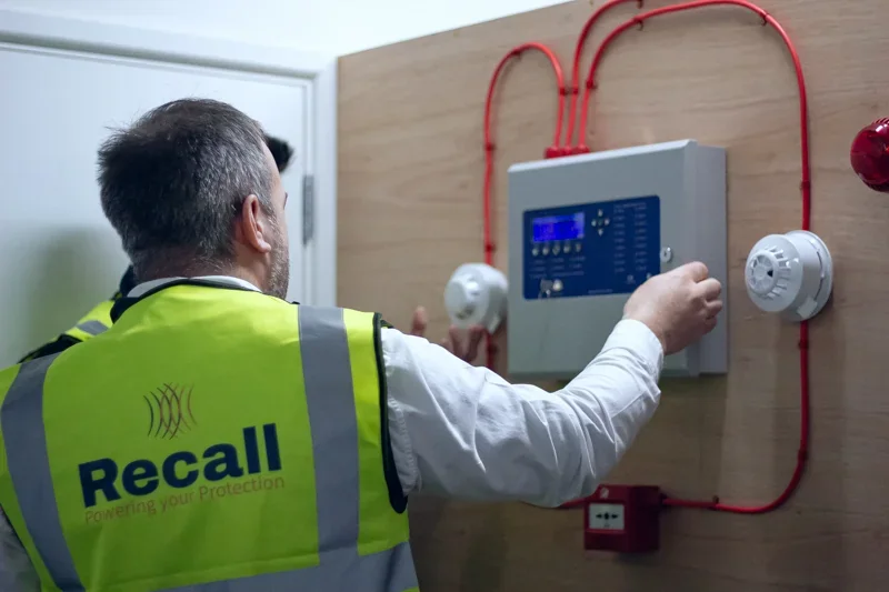 Close-up of fire alarm control panel during Recall SW fire safety training session